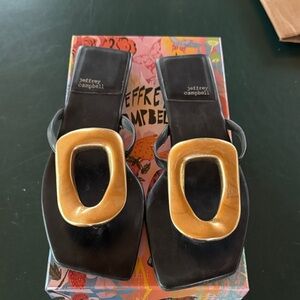 Jeffery Campbell black sandals with gold toe piece. Worn a couple times size 8.5